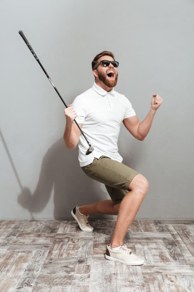Golfer celebrating after a round - shop second hand golf balls at GreenBlue Golf